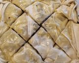 A picture of step 7 of Christmas pudding baklava.