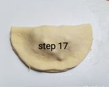 A picture of step 18 of Bow tie buns.