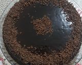 A picture of step 9 of Choco cake with Chocolate ganache topped with Chocolate scrapes.