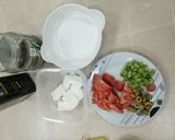 A picture of step 1 of Haloumie cheese with tomato.