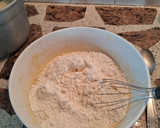 Foto del paso 3 de la receta: Torta marmolada de aceite con pasas de uva