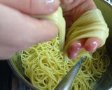 Foto del passaggio 4 della ricetta Nidi di tagliolini fritti con piselli e fonduta al gorgonzola