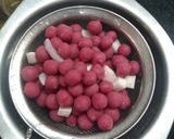 A picture of step 9 of Hibiscus Thai rice balls dunk in coconut milk.
