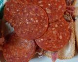 A picture of step 1 of Leftover Pizza Topping Sandwich.