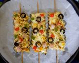 A picture of step 3 of Penne pasta pizza sticks.