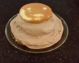 A picture of step 16 of Hazelnut Layer Cake with Hazelnut Cream Frosting.
