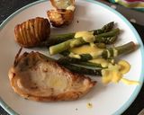 A picture of step 6 of Brined Pork Chops with Hasselback Potatoes, tender, buttery Asparagus and sharp Hollandaise Sauce.