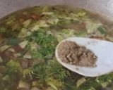 A picture of step 4 of Ragi flour mix vegetable soup.