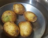 A picture of step 1 of Aloo ka bharta.