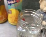 A picture of step 1 of Orangy Mango Cocktail.