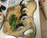 A picture of step 8 of Sushi vegetable roll.