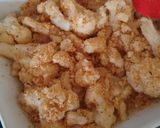 A picture of step 3 of Cauliflower Cheese rolled in breadcrumbs.
