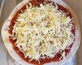 A picture of step 11 of Completely homemade chicken madras pizzas.