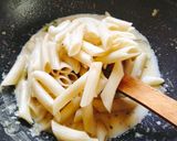 A picture of step 2 of Italian pasta Italian white sauce pasta.