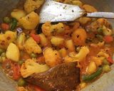 A picture of step 4 of Gobhi Matar Curry.