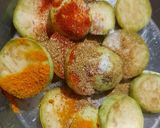A picture of step 2 of Brinjal disk or baigan bhaja.