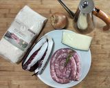 Foto del passaggio 1 della ricetta Risotto al radicchio con salsiccia e asiago