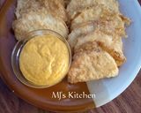 A picture of step 7 of Fried yam coated with egg and spicy fry sauce.