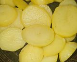 Foto del paso 5 de la receta Patatas confitadas al aroma de langostinos al ajillo