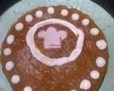 A picture of step 17 of Vanilla tutti fruity cake with Mango topping.