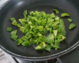 A picture of step 2 of Corn capsicum paneer in yellow gravy using premix.