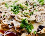 A picture of step 7 of Loaded Nachos with Mango Salsa, Sour cream and cheese sauce.