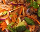 A picture of step 2 of Jacket potato with beef stir fry and gyoza chicken dumplings.