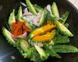 A picture of step 3 of Pyaj Karela fry (Onion and bitter gourd fry).