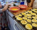 A picture of step 4 of Zuccinni Parmesean.