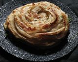 A picture of step 9 of Parotta and Chicken Salna.