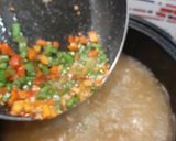 A picture of step 5 of Manchow Soup / Veg soup topped with Crispy fried noodles.