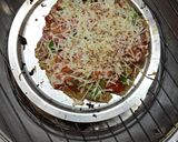 A picture of step 8 of Palak paneer parathapizza.
