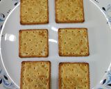 A picture of step 1 of Cream cracker pizza bites.