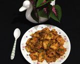 A picture of step 8 of Chatpata Bread Upma in red sauce.