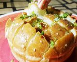 A picture of step 6 of Pull over garlic bread.