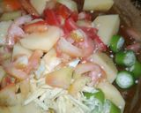 A picture of step 4 of Aloo qeema.