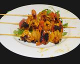 A picture of step 5 of Paneer Tikka with colorful veggies.