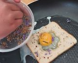 A picture of step 6 of Savoury Rosemary Flower Egg in a Hole.