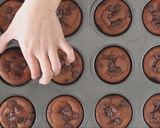 A picture of step 8 of Mochi Brownies in a Muffin Tin.