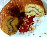 A picture of step 5 of Kake stuffed with chocolate cookie powder, cinnamon, almonds.