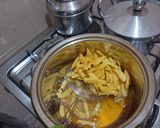A picture of step 11 of Indomie noodles and potatoes chips.