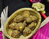 A picture of step 7 of Wheat flour seeds and nuts Ladoo with leftover ghee residue.