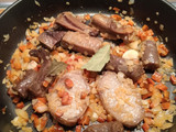 Arroz meloso con alcachofas y conserva de cerdo