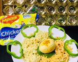 A picture of step 4 of Chicken schezwan Maggi noodles and tossed boiled egg with Maggi seasoning.