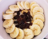 Foto del paso 6 de la receta: Gachas de avena con mix de frutos secos, uvas pasas y chocolate