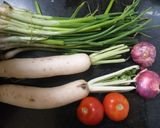 A picture of step 1 of Radish and spring onion curry.