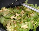 A picture of step 11 of Bitter gourd with egg.