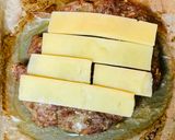 A picture of step 7 of Cheddar cheeseburger with potatoes and salad.