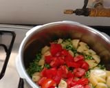 A picture of step 2 of Aloo chorifali and tomato sabji.