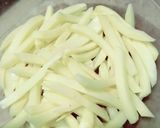 A picture of step 1 of Masala French fries.